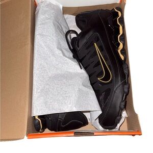 Nike Black Sneakers with Gold Swoosh